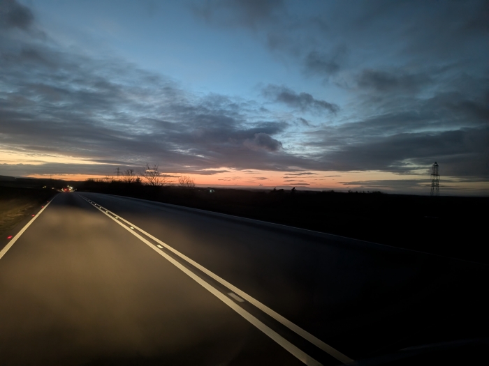 A lovely open road  at sunset, part of a same day delivery route